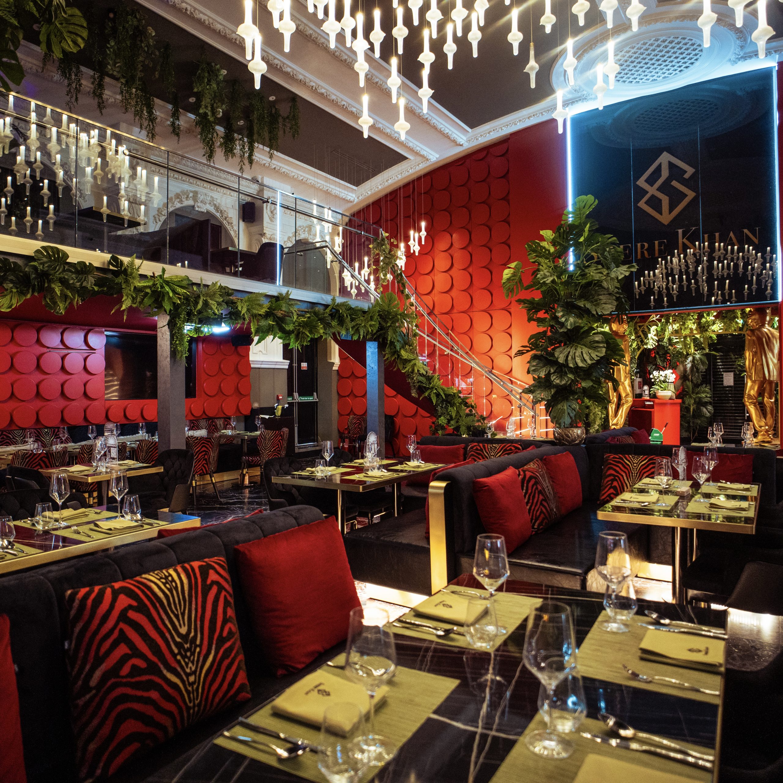 Shere Khan restaurant jungle themed interior with artificial trees and atmospheric lighting